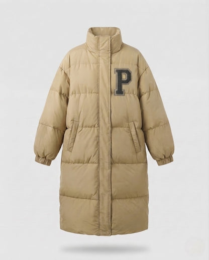 Women's longer boxy thermo puffer with high stand-up collar, college patch, and noise-reducing outer shell