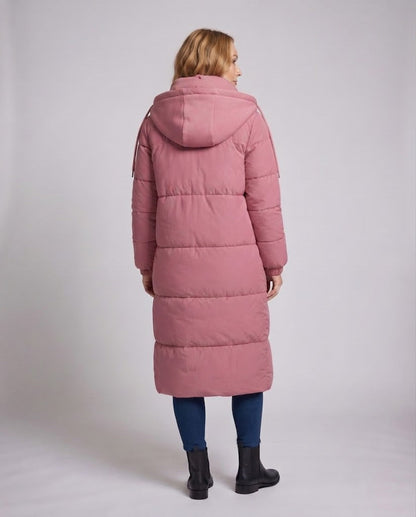 Women's longer minimalist padded coat with high wrap collar and straight square quilting seams