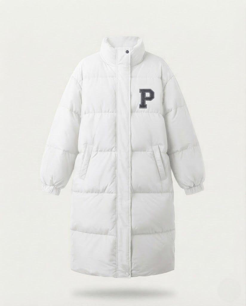 Women's longer boxy thermo puffer with high stand-up collar, college patch, and noise-reducing outer shell