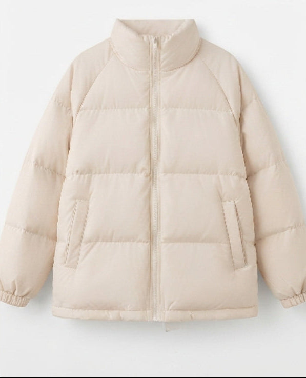 Women's short shiny boxy puffer with a high stand-up collar and voluminous sleeves