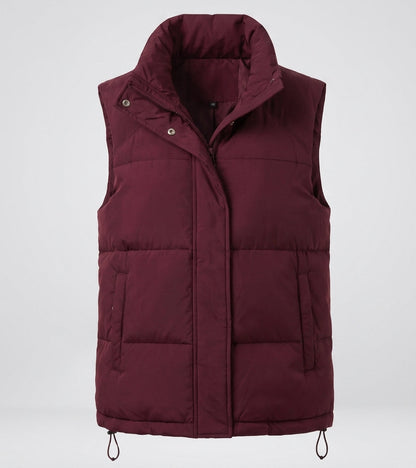 Women's quilted insulation vest with extra high polo collar, concealed snap button placket and side zip pockets