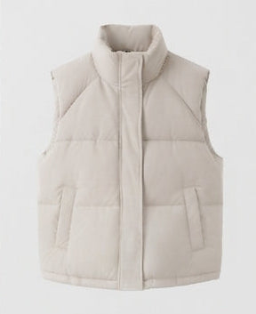 Women's non-padded thermal quilted vest with high standing collar, concealed two-way zipper, and practical flap pockets