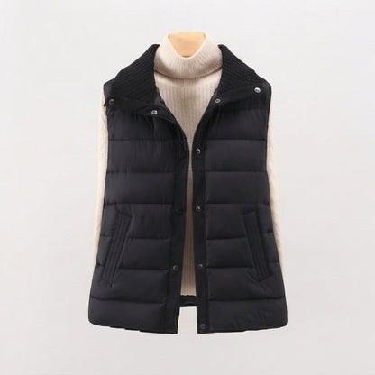 Women's non-padded quilted gilet with high ribbed shawl collar and concealed snap button placket
