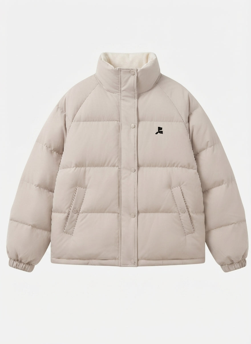 Women's short oversized quilted jacket with high-closing collar and concealed press stud placket