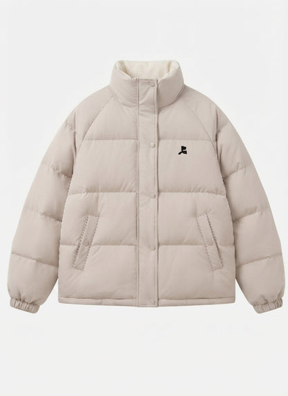 Women's short oversized quilted jacket with high-closing collar and concealed press stud placket