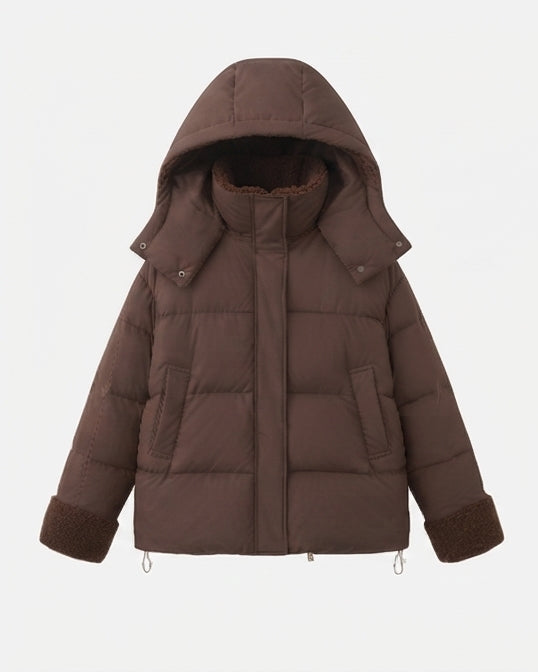 Women's short quilted travel-friendly winter parka with teddy cuffs, stowable hood, and spacious side pockets