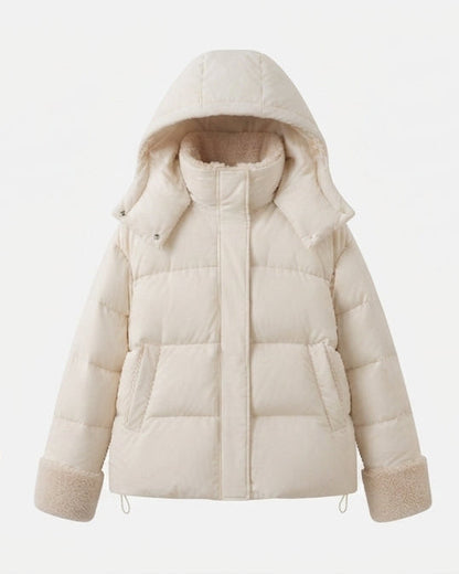 Women's short quilted travel-friendly winter parka with teddy cuffs, stowable hood, and spacious side pockets