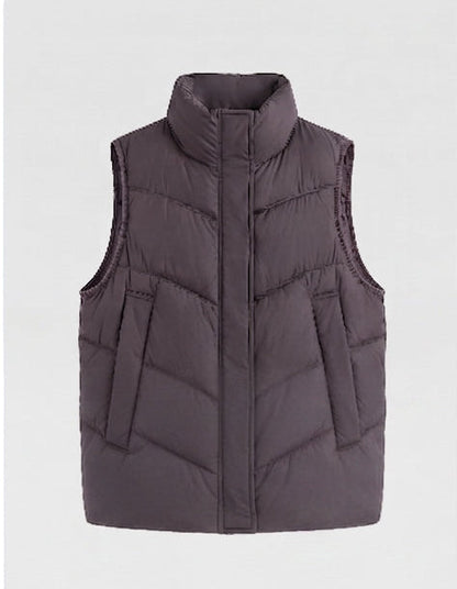 Women's non-padded quilted vest with high stand-up collar, adjustable drawstring hem, and generous flap pockets