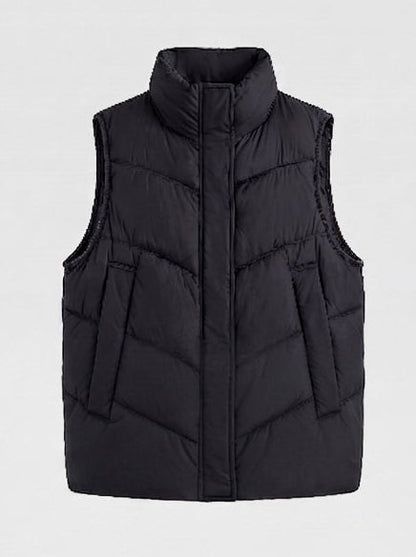 Women's non-padded quilted vest with high stand-up collar, adjustable drawstring hem, and generous flap pockets