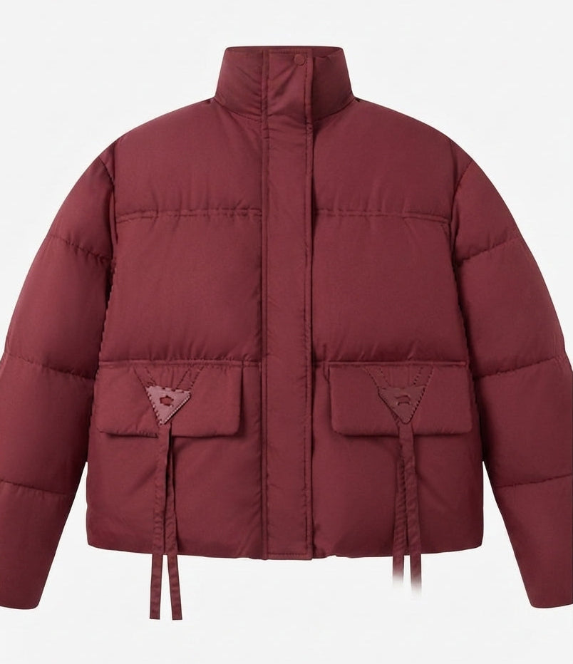 Women's short vegan boxy puffer jacket with asymmetrical flap patch pockets and high collar