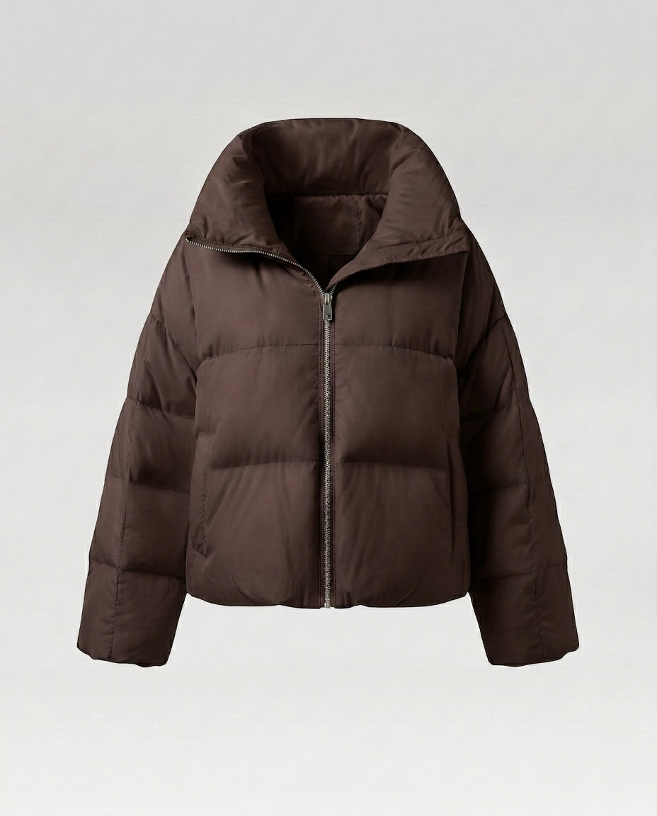 Women's cropped quilted jacket with oversized hood, lightweight thermal filling, and rounded hem