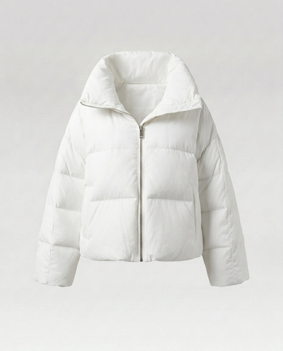 Women's cropped quilted jacket with oversized hood, lightweight thermal filling, and rounded hem