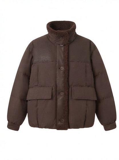 Women's short quilted bomber jacket with teddy lining, faux leather front panels, and patch pockets