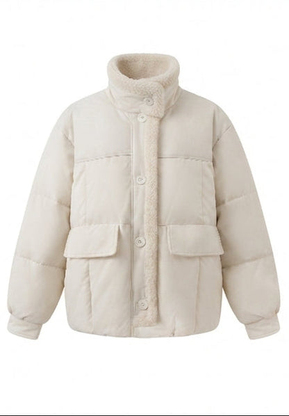 Women's short quilted bomber jacket with teddy lining, faux leather front panels, and patch pockets