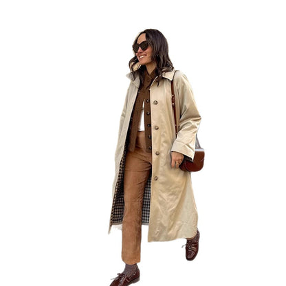 Women's maxi-length trench coat with check lining, wide fall & classic button placket