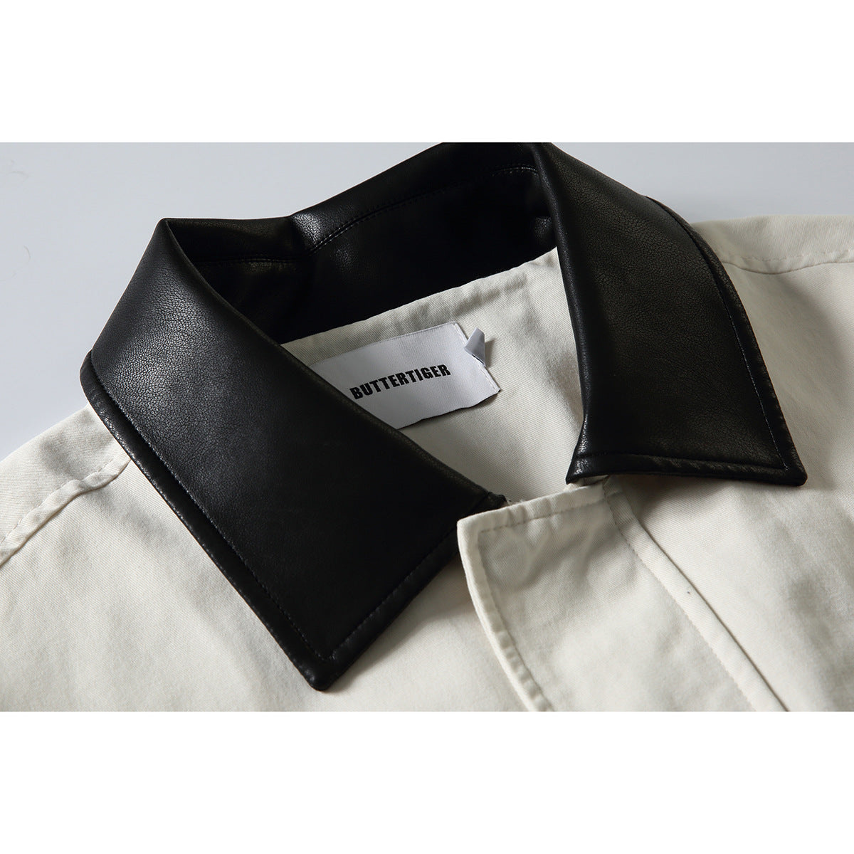 Men's short-cut boxy blouson jacket with faux leather collar, drawstring hem, and snap button cuffs EVA-US