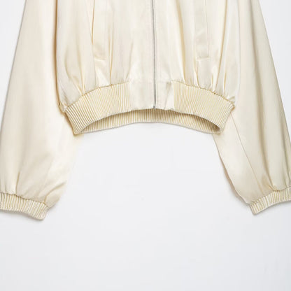 Women's cropped bomber jacket made of vegan leather look with voluminous raglan sleeves and ribbed cuffs.