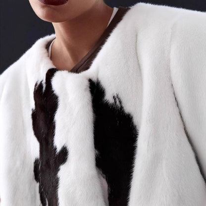 Women's short coat made of faux fur with boxy silhouette and cow print pattern EVA-US