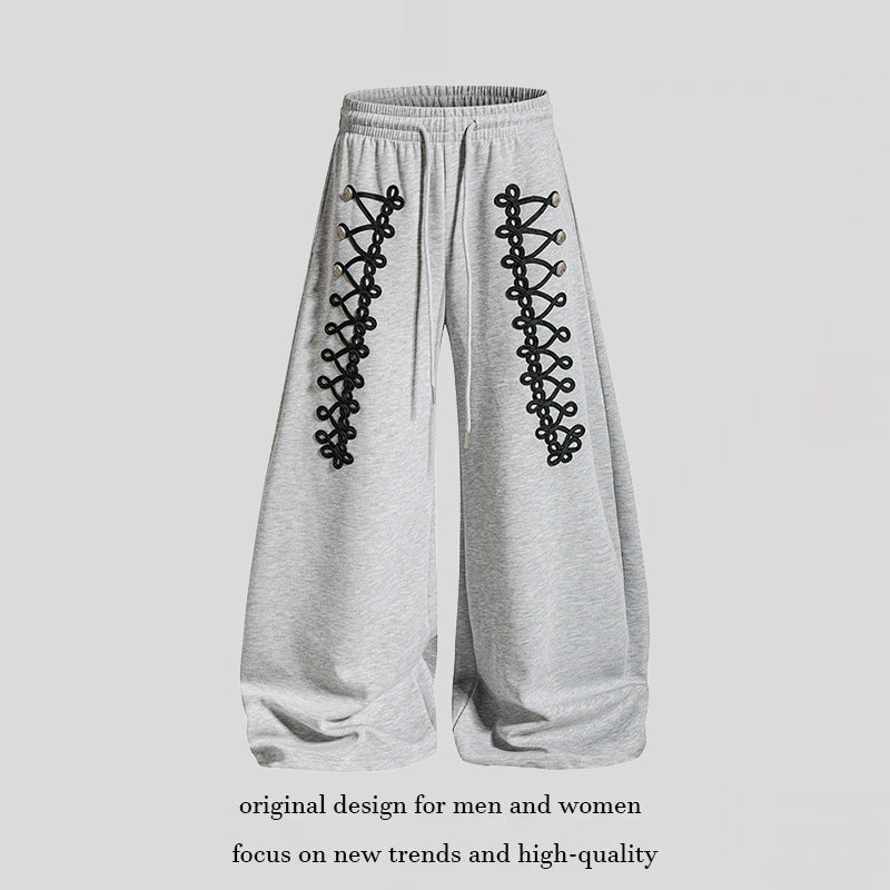 Women's loose jogging pants with elastic waistband and decorative lacing EVA-US