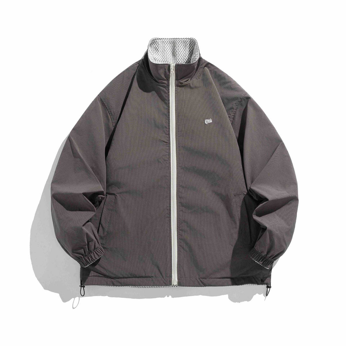 Unisex structure fleece jacket with high stand-up collar, zip pockets and drawstring hem EVA-US