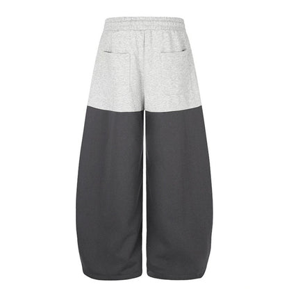 Women's Oversize Two-Tone Palazzo Sweatpants made of French Terry with logo studs, drawstring and adjustable hem.