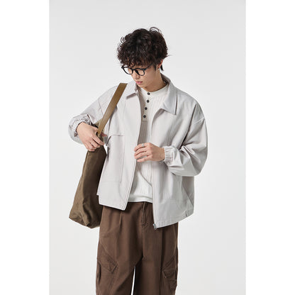 Unisex short jacket in boxy cut with continuous zipper and flap pockets EVA-US