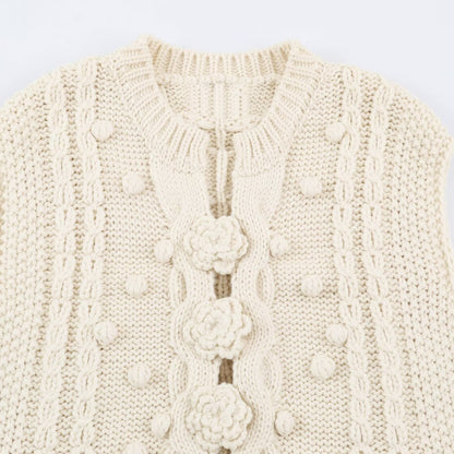 Women's knitted vest with cable pattern, flower appliqués and bobble texture EVA-US