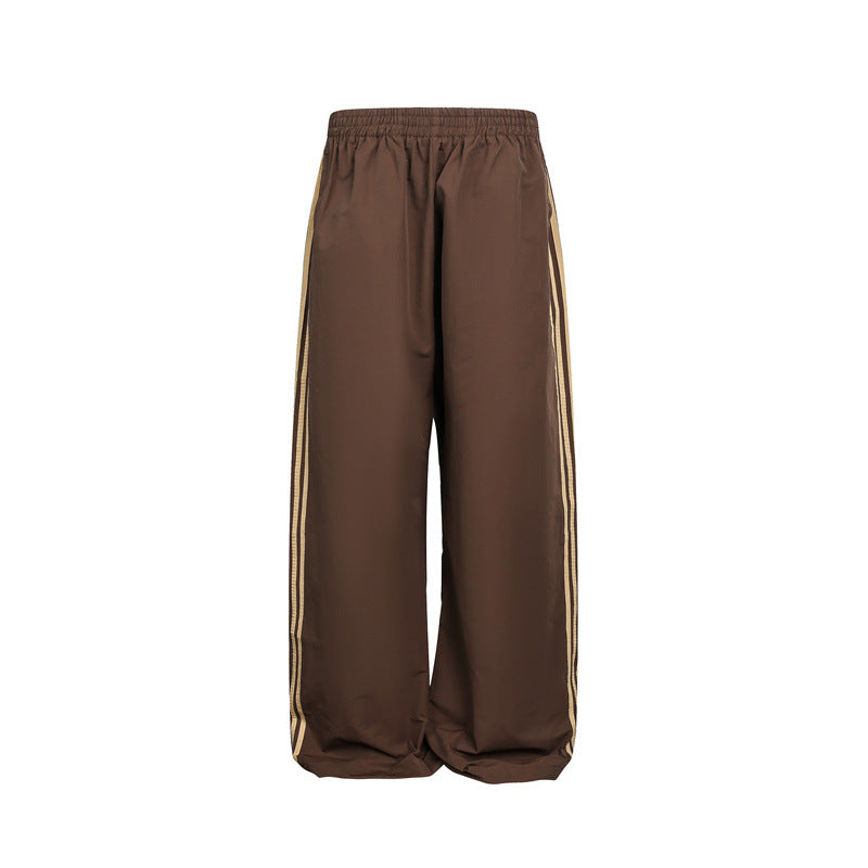 Women's wide satin training pants with elastic waistband and side contrast stripes EVA-US