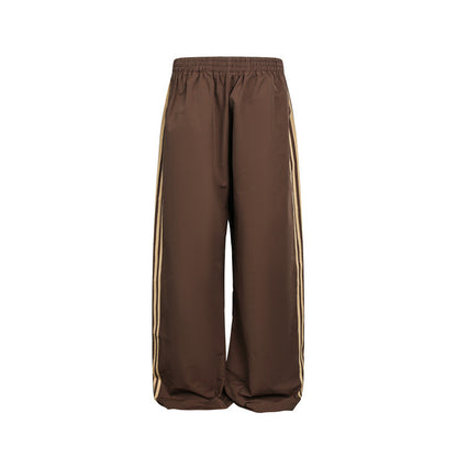 Women's wide satin training pants with elastic waistband and side contrast stripes EVA-US