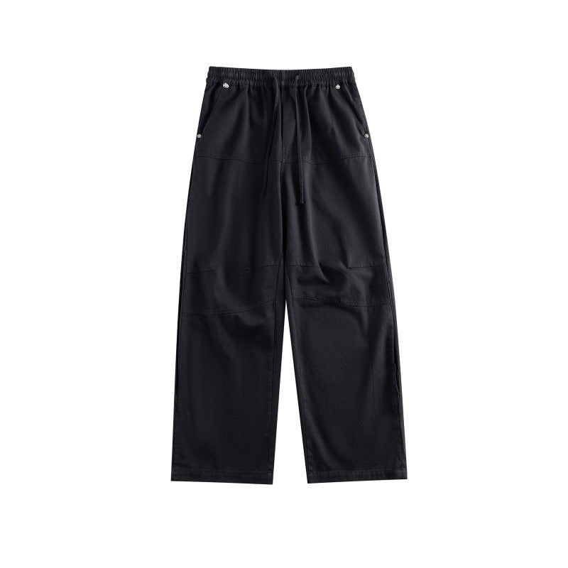 Women's wide utility-style culotte pants with elastic waistband, drawstring, and patch pockets.