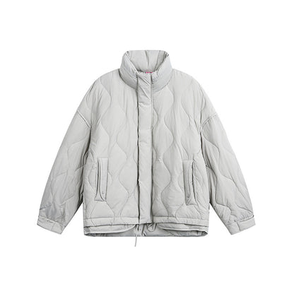 Women's oversized quilted jacket with stand-up collar, wave quilting, and drawstring hood