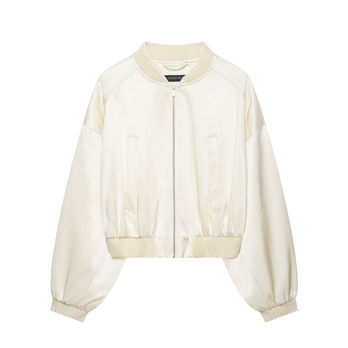 Women's cropped bomber jacket made of vegan leather look with voluminous raglan sleeves and ribbed cuffs.