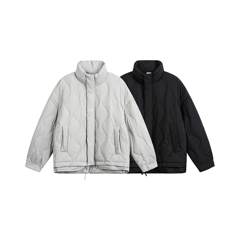 Women's oversized quilted jacket with stand-up collar, wave quilting, and drawstring hood
