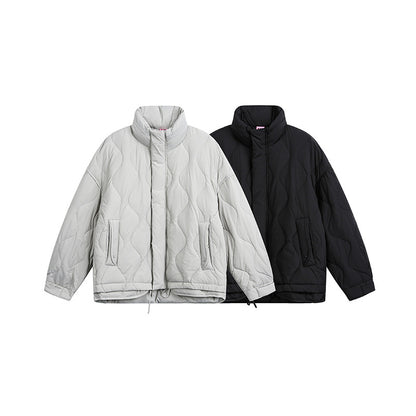 Women's oversized quilted jacket with stand-up collar, wave quilting, and drawstring hood