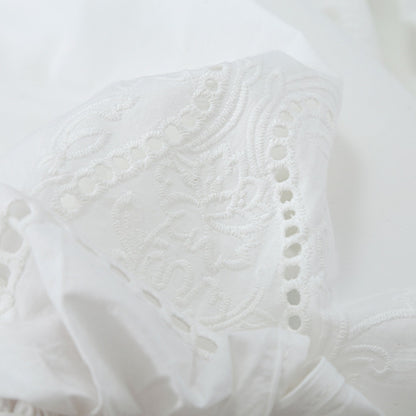 Women's blouse with V-neckline, broderie embroidery, and voluminous puff sleeves EVA-US
