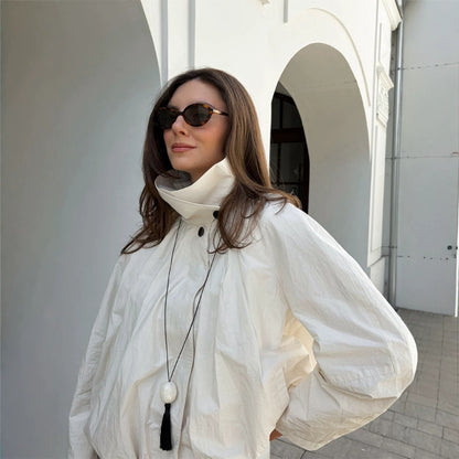 Women's short jacket with high stand-up collar, gathered shoulder area, and elastic hem EVA-US