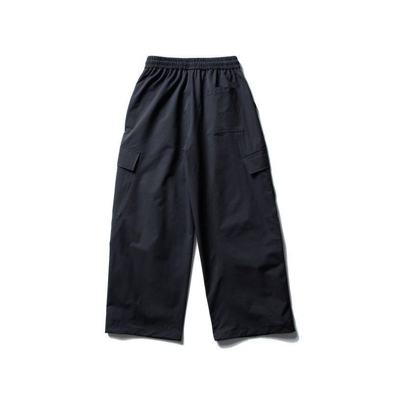 Unisex Wide Cargo Utility Pants in Baggy Cut with Elastic Drawstring and Generous Flap Pockets