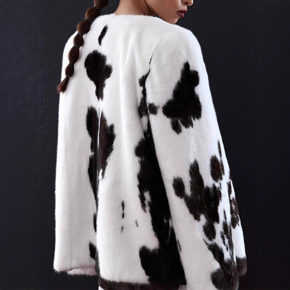 Women's short coat made of faux fur with boxy silhouette and cow print pattern EVA-US