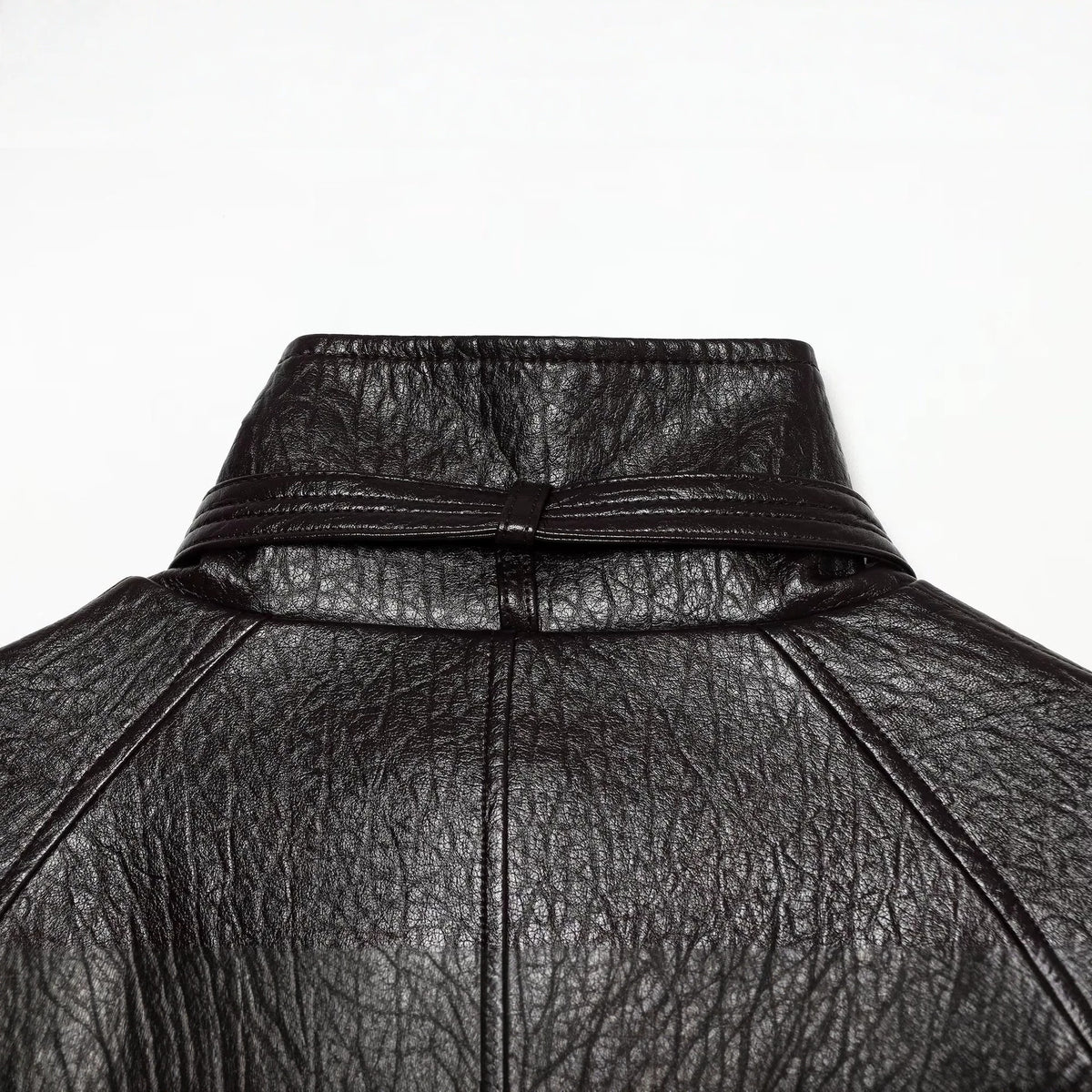 Women's short jacket made of faux leather with high buckle collar and waist belt EVA-US