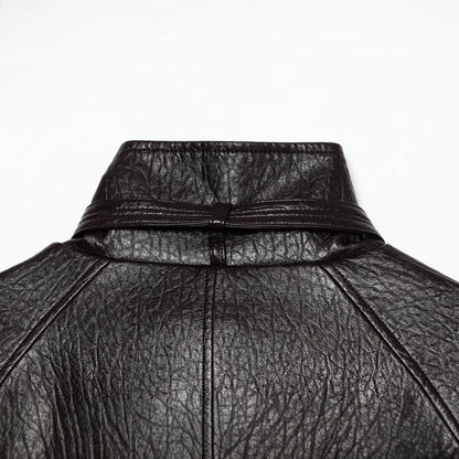 Women's short jacket made of faux leather with high buckle collar and waist belt EVA-US