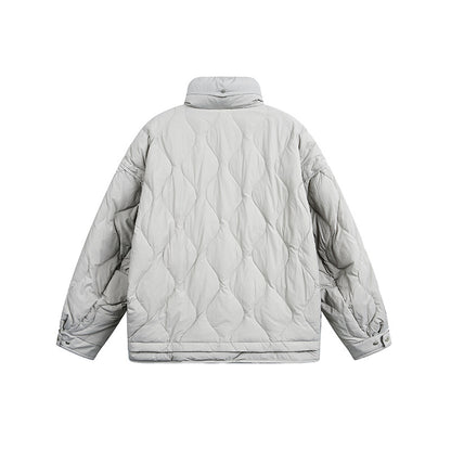Women's oversized quilted jacket with stand-up collar, wave quilting, and drawstring hood