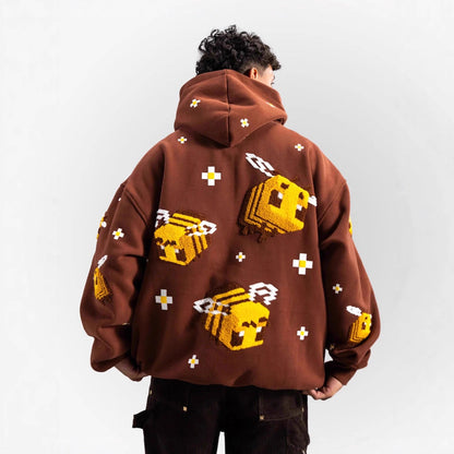 Unisex knitted hoodie with integrated pixel bee design and applied kangaroo pocket EVA-US