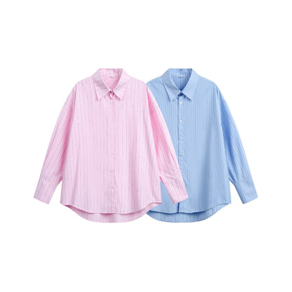 Women's oversized shirt blouse with fine pinstripe texture and rounded hem.