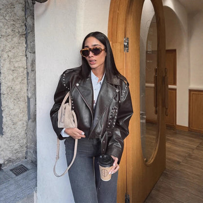 Women's Short Studded Biker Jacket Made of Faux Leather with Waist Belt EVA-US