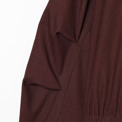 Women's short bomber-style jacket with high funnel collar, concealed zipper, and flap pockets EVA-US