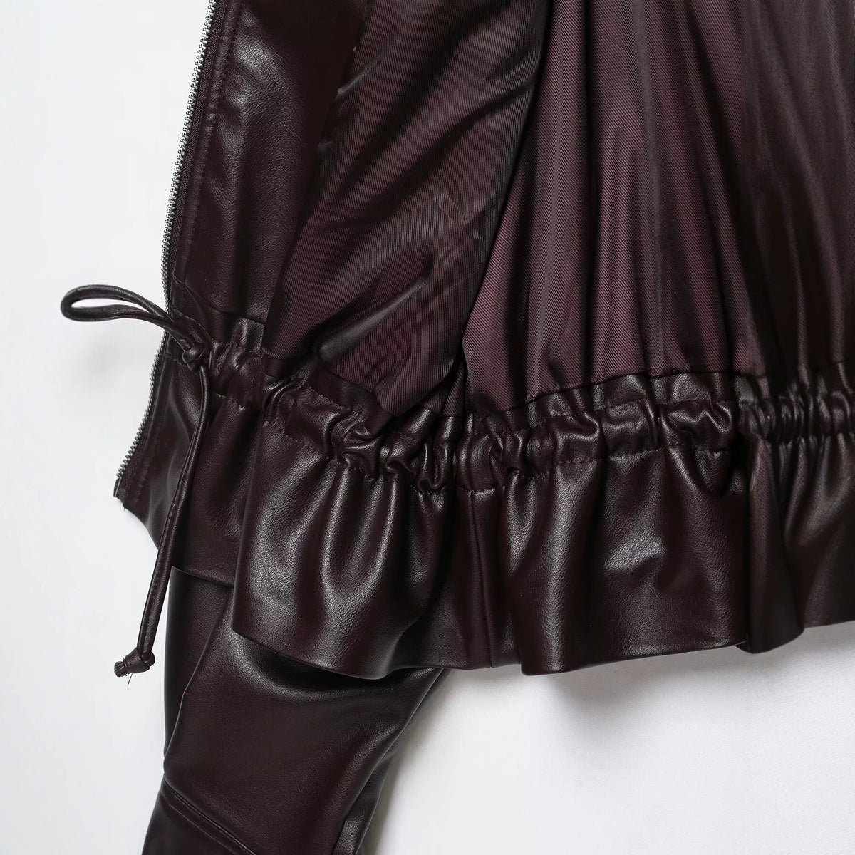 Women's Oversized Faux Leather Bomber Jacket with Funnel Neck, Drawstring Waist, and Flap Pockets EVA-US