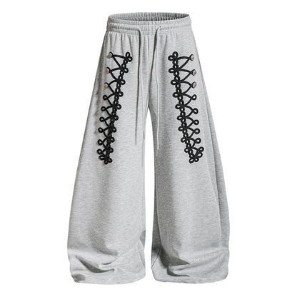 Women's loose jogging pants with elastic waistband and decorative lacing EVA-US