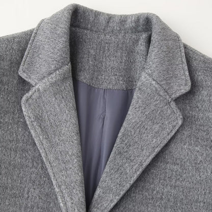 Women's short blazer coat made of wool blend with lapel collar, two-button closure, and patch pockets EVA-US