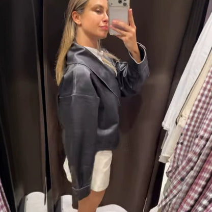 Women's short jacket made of synthetic leather with side buckle waist and voluminous raglan sleeves EVA-US