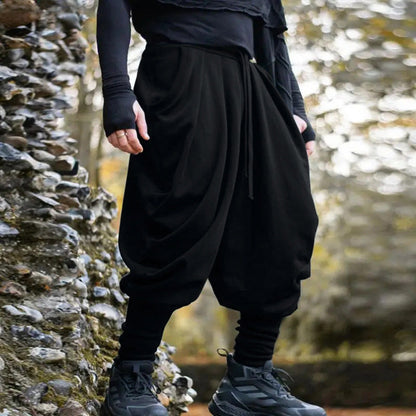 Men's avant-garde harem pants with wrap front, elastic waistband, and narrow lower leg EVA-US